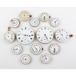 A collection of fourteen mechanical watch movements with dials attached.