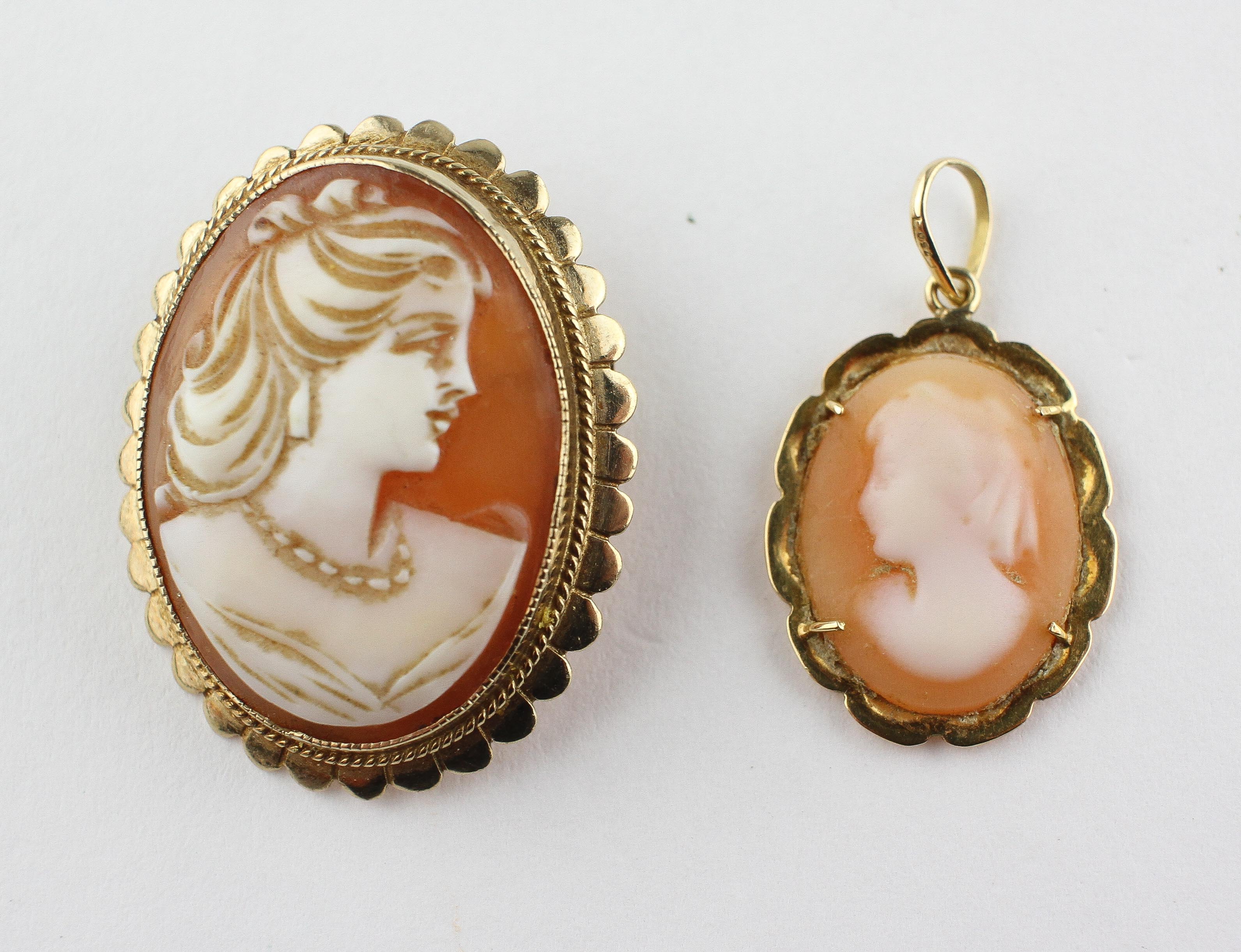 A yellow metal oval carved cameo brooch set within a fancy edge mount.