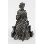 19th century school, A classical maiden sat on a chair holding a flower, brown patinated bronze,
