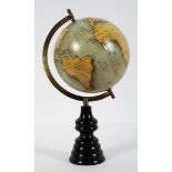 A modern globe with printed gores and turned ebonised plinth,