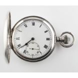 A half hunter pocket watch. Circular white dial with roman numerals.