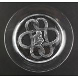 A Lalique dish of circular form, with cupid inside a Lovers knot, etched "Lalique, France"