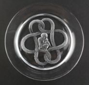 A Lalique dish of circular form, with cupid inside a Lovers knot, etched "Lalique, France"