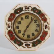 An ivory framed easel back clock, 1920's, the circular dial inside an octagonal frame