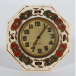 An ivory framed easel back clock, 1920's, the circular dial inside an octagonal frame
