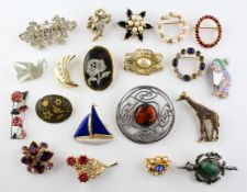 A collection of twenty costume brooches of variable designs.