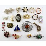 A collection of twenty costume brooches of variable designs.