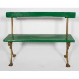 A bench, possibly from a tram, with painted wood back rest and seat,