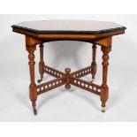 An aesthetic style walnut and ebonised octagonal centre table,