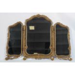 A French style gilt framed triptych dressing table mirror, with flower moulded frame,