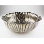 A large Middle Eastern white metal bowl in the form of a water lily, indistinctly marked,