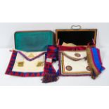 A collection of Masonic regalia, mainly aprons and sashes,