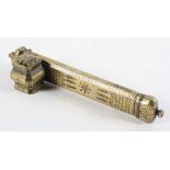 A Middle Eastern brass pen box and ink well with chased foliate decoration,