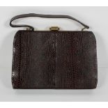 A brown snakeskin handbag, with gilt metal mount, apparently un-used, with original card box,