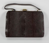 A brown snakeskin handbag, with gilt metal mount, apparently un-used, with original card box,