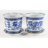 A pair of Chinese Kangxi style blue and white jardinieres and stands, 20th century,