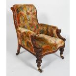 A Victorian oak framed armchair, with button back, serpentine seat and carved front legs,