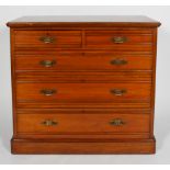 An aesthetic style walnut chest of two short and three graduated long drawers with moulded