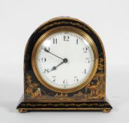 A Georgian style Japanned mantel clock, the enamelled dial on a French brass movement,