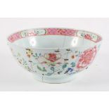 A Chinese Famille Rose fruit bowl, late 18th or early 19th century, decorated with floral sprays,