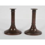 A pair of bronze candlesticks, 17th century style, on oval bases,