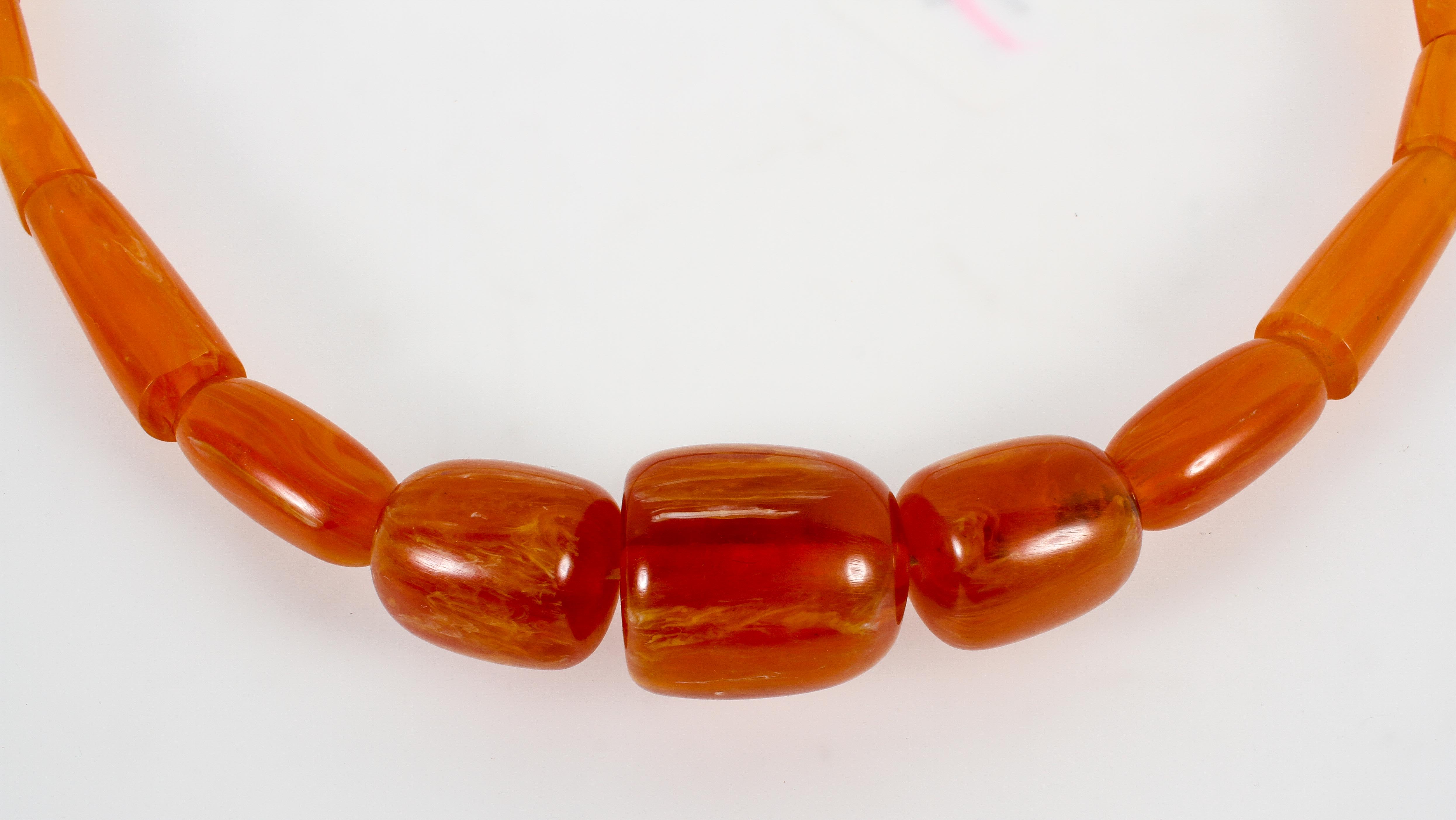 A large graduated orange bead necklace, strung plain with no clasp. - Image 2 of 2