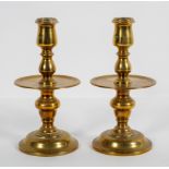 A pair of Dutch Heemskirk style candlesticks, with broad drip trays,