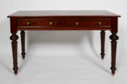 A Victorian mahogany side table with a pair of drawers on carved and tapering legs,