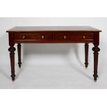 A Victorian mahogany side table with a pair of drawers on carved and tapering legs,