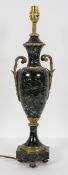 A Neo classical green marble and gilt metal mounted lamp stand, of two handled amphora form,