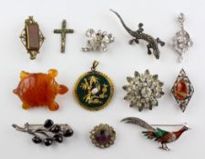 A collection of twelve costume brooches of variable designs.