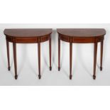 A pair of Georgian style mahogany and inlaid pier tables, the bow fronted top with cross banding,