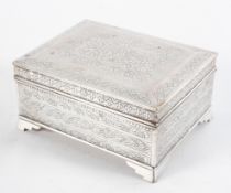 A Middle Eastern white metal cigarette box and cover,