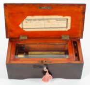 A small Swiss music box, with a single cylinder playing four airs, the case with line inlay,