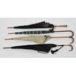 A collection of four umbrellas and parasols, various dates,