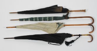 A collection of four umbrellas and parasols, various dates,