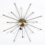 A contemporary Sunburst wall clock/lamp, in the style of George Nelson,