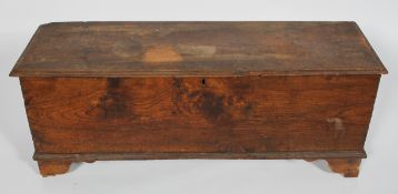 An elm coffer, late 17th century, with candle box interior and notched decoration,