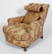 A walnut framed armchair, highly embroidered with scrolled back rest,