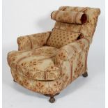 A walnut framed armchair, highly embroidered with scrolled back rest,