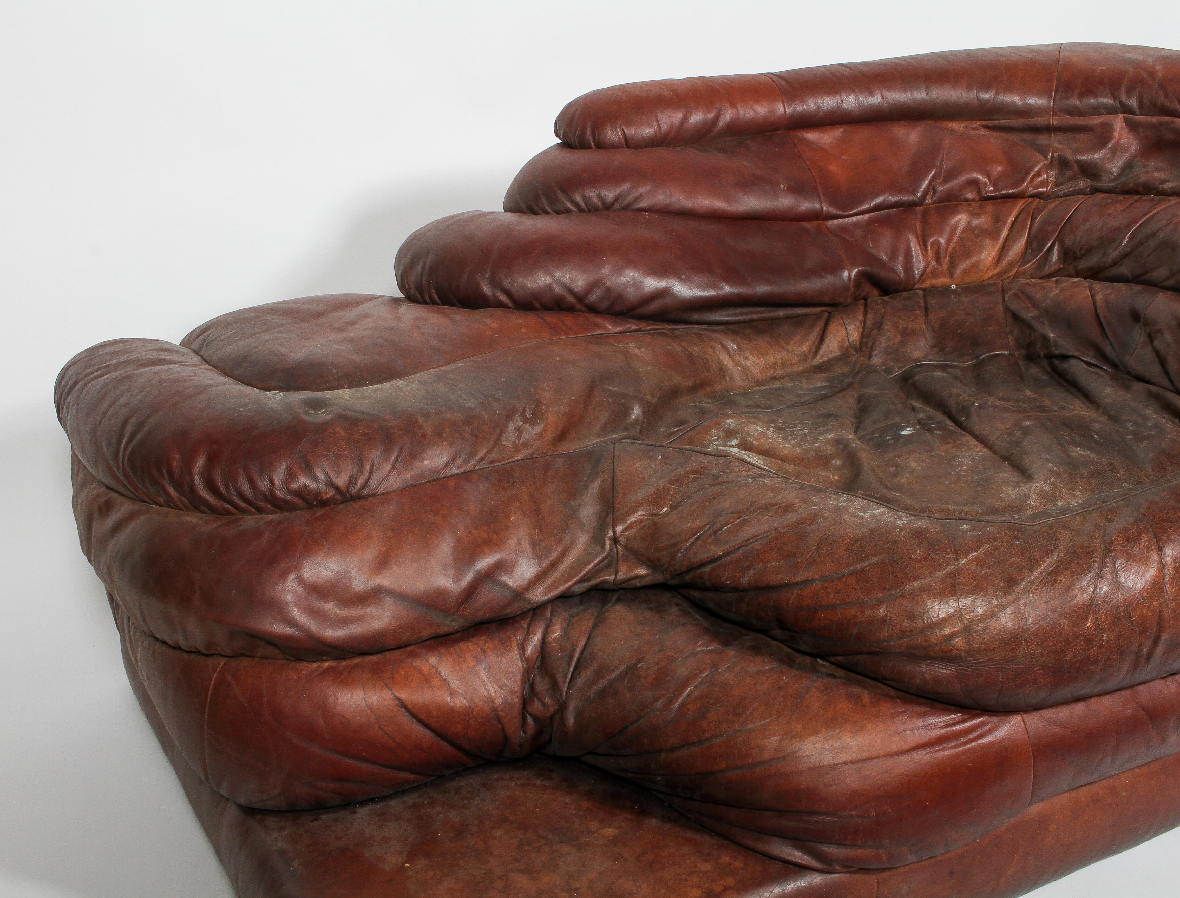 A 20th century vintage leather chaise longue, of rippled form, possibly of Danish design, - Image 2 of 4