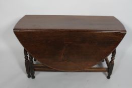 An oak gateleg dining table, 18th century and later,