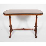 A Victorian walnut and inlaid centre table with amboyna banding on turned supports with scrolling