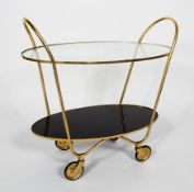 A 1950's Deco style cocktail trolley, of ovoid form with two glass tiers,
