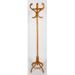 A beech bent wood coat stand, with inlaid scrolling hooks and down swept legs,