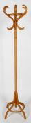 A beech bent wood coat stand, with inlaid scrolling hooks and down swept legs,