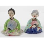 A pair of Chinese stoneware nodding figures of a boy and girl with fans,