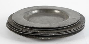 A group of six pewter plates, 18th century, with plain rims, some with touch marks,