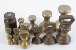 A collection of brass weights,