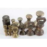 A collection of brass weights,